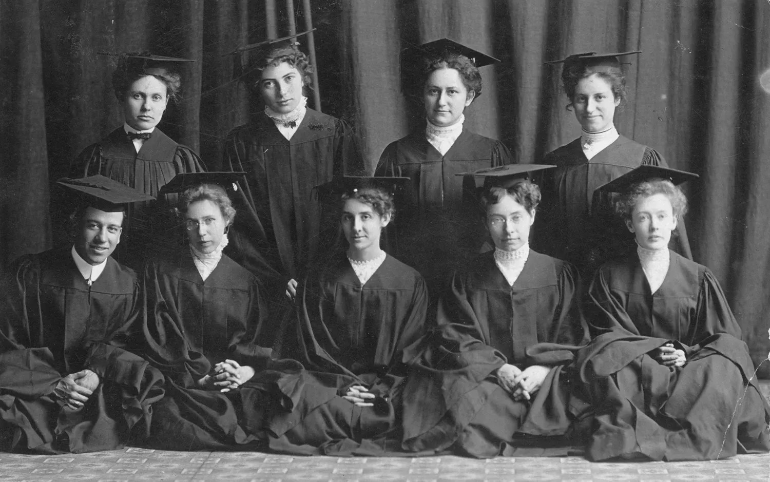 Group of students in graduation robes and mortarboards